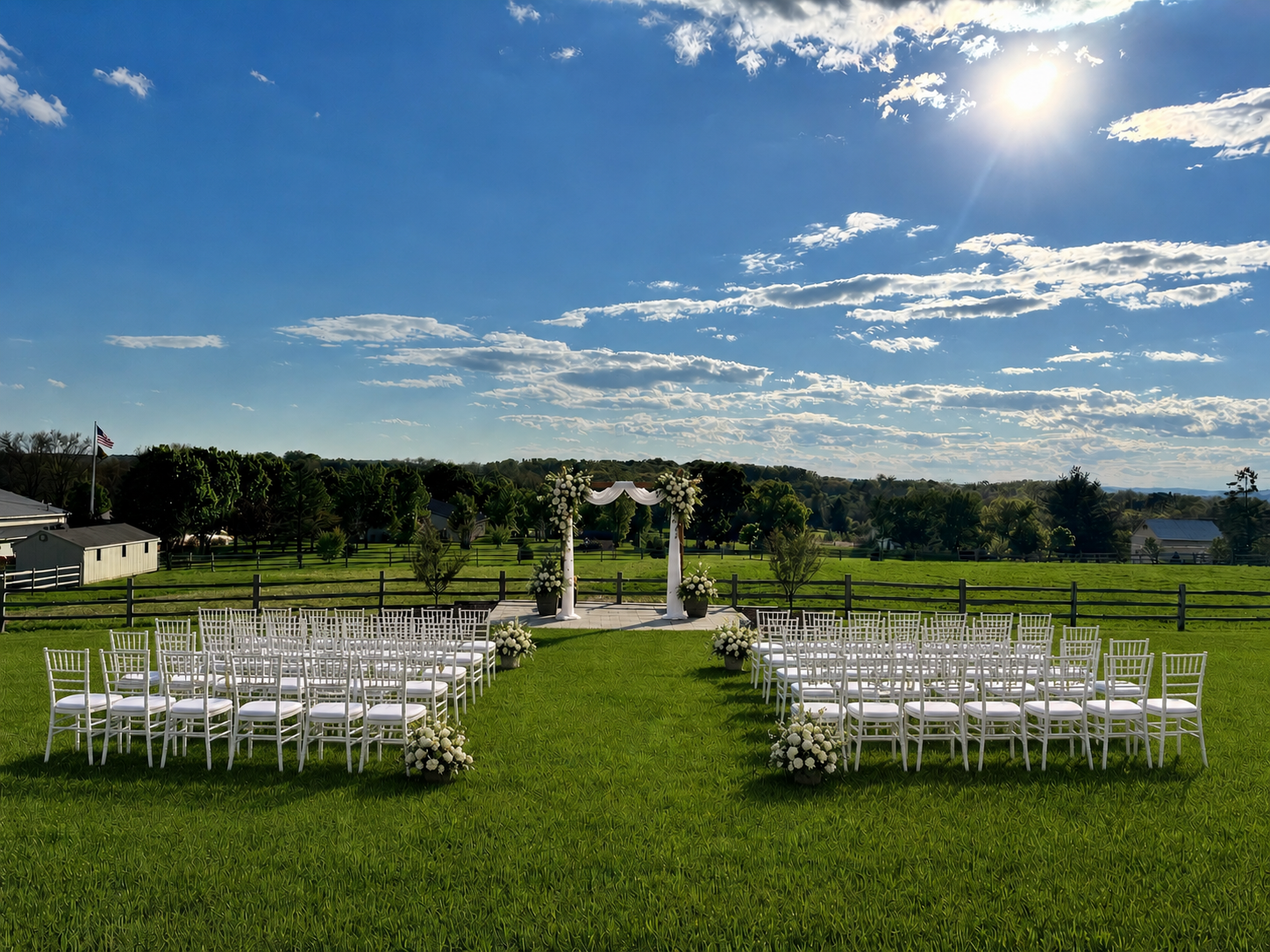 An outdoor wedding ceremony set on the estate lawn