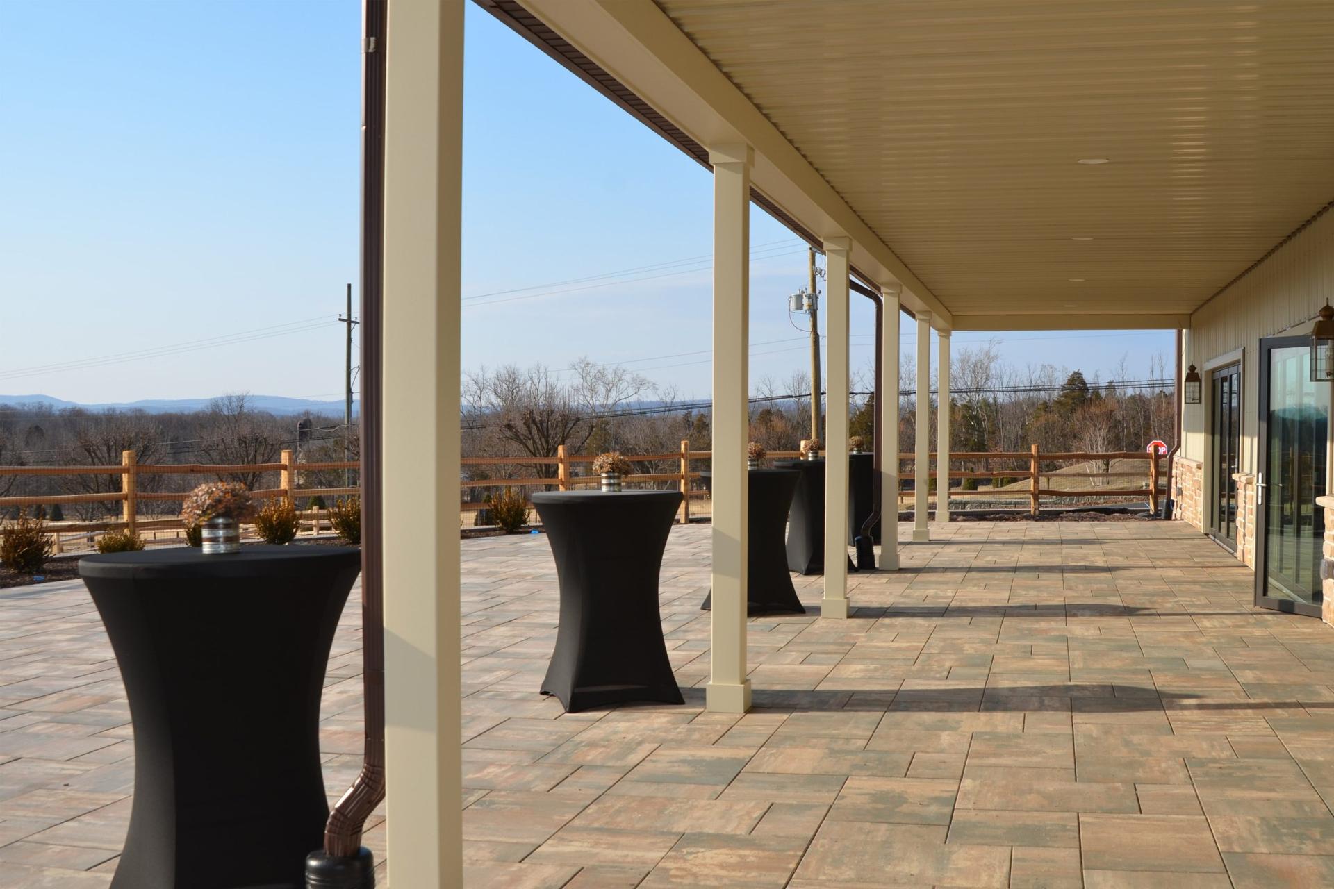 The covered porch at the Welcome Center looking out over the grounds and rolling hills